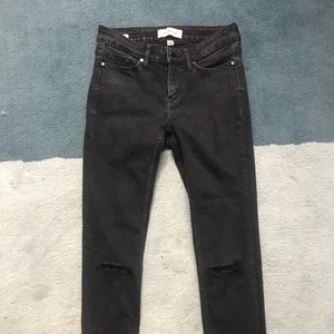 NWOT Calvin Klein black jeans with ripped knees